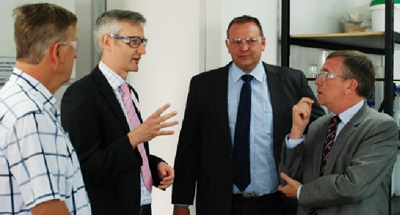 Bioproton managing director Henrik von Hellens (left), AIBN's Dr Rob Speight, Bioproton technical manager Juhani von Hellens and Minister Ian Walker.