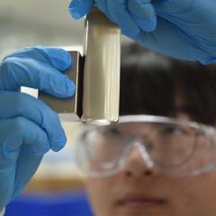 PhD candidate Xiao Tan separates the polymer-coated PFAS from the water. 