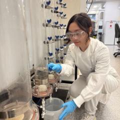 AIBN researcher Dr Zicheng Su pictured with a PFAS pilot device that will be used to accelerate the research 